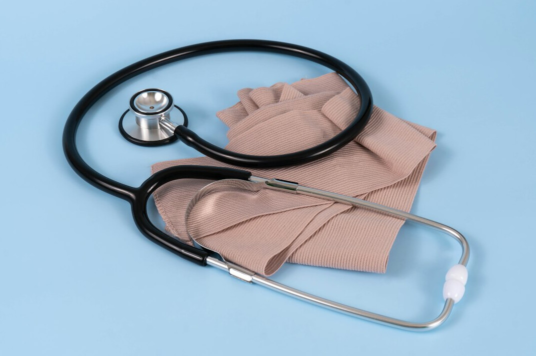 Stethoscope on patient charts and clipboard